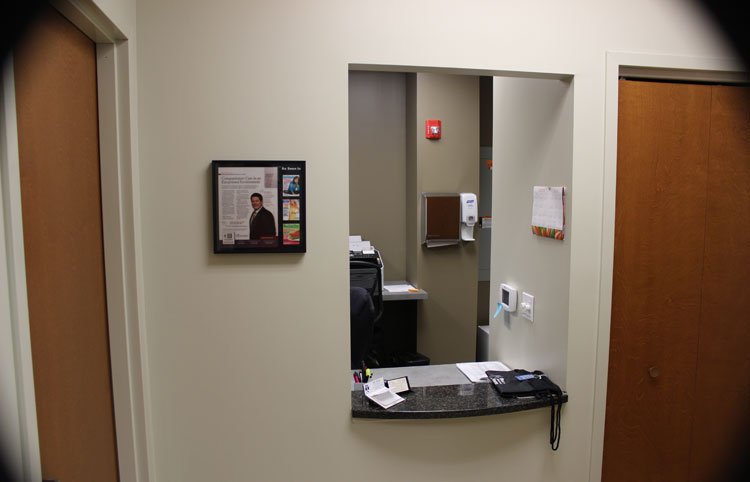 Receptionist and desk interior photo of Newton PA oral surgery center