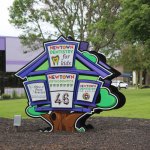 Exterior sign photo that includes sign for the Newton office of the Oral & Maxillofacial Surgery Center in Newton PA