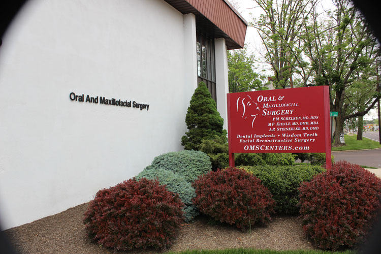 Exterior photo of oral surgery practice sign: Oral & Maxillofacial Surgery Center in Warminster PA