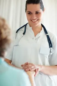 Photo of oral surgery staff addressing a patient