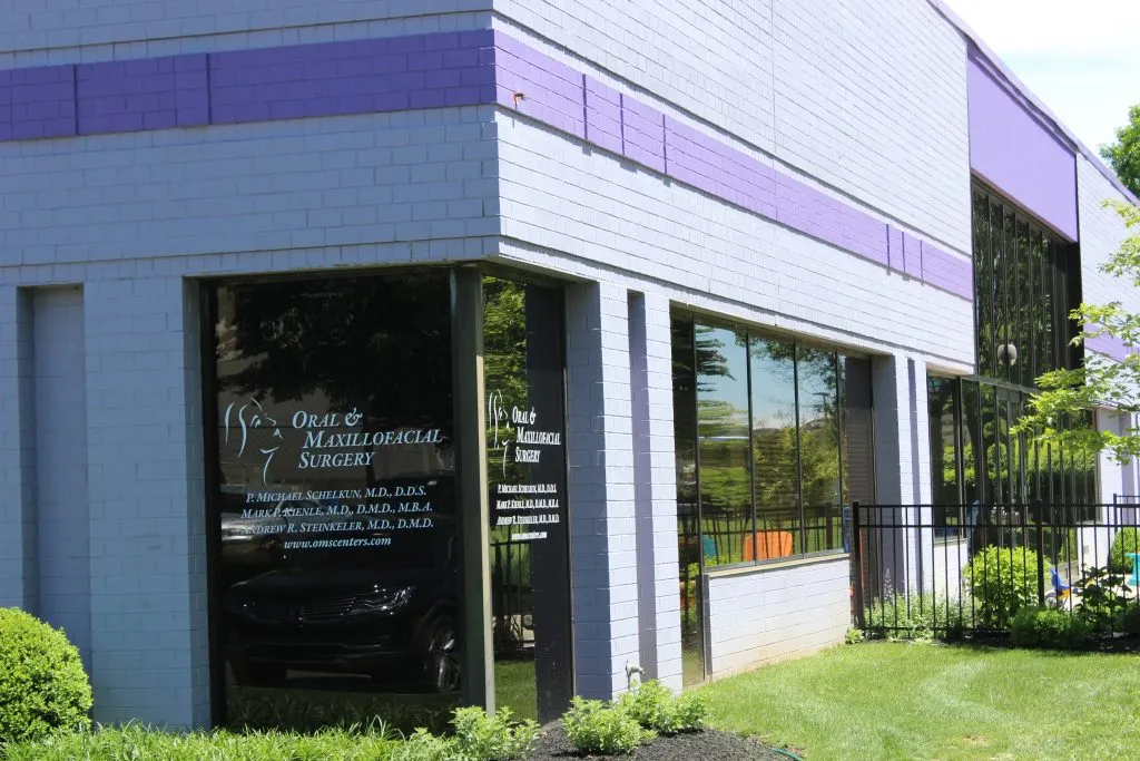 Exterior photo: Newtown Oral Surgery practice front door of Drs. Schelkun & Kienle Associates